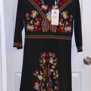 Black dress with colorful embroidery. 3/4 length long sleeve. Never been worn.